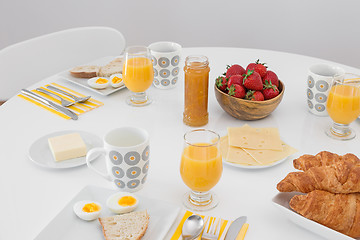 Image showing Simple tasty breakfast on a white table