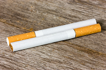 Image showing  Cigarettes on the wooden floor