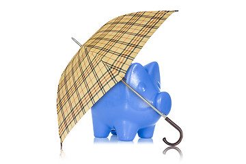 Image showing Piggy bank with umbrella on white background