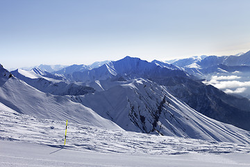 Image showing Ski slope and mountains in haze