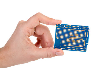 Image showing Blue prototyping PCB in a hand