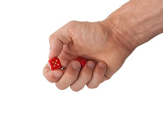 Image showing Hand holding red dices