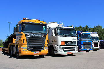 Image showing Row of Trucks Parked