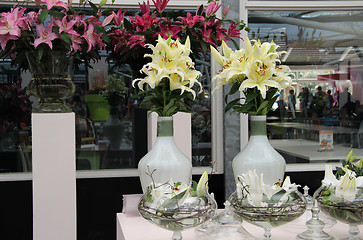 Image showing Big mix of amazing flowers in vases