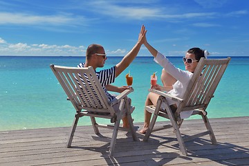 Image showing happy young couple relax and take fresh drink