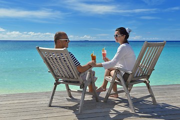 Image showing happy young couple relax and take fresh drink