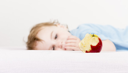 Image showing apple with child in background