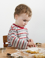 Image showing young child making cookies