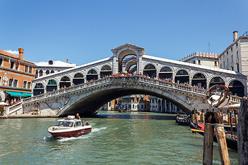 Image showing ITALY, VENICE - JULY 2012 - A lot of traffic on the Grand Canal under Ponte di Rialto on July 16, 2012 in Venice. More than 20 m