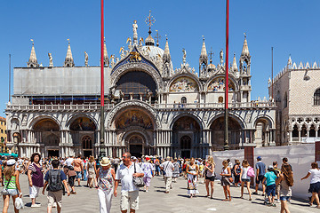 Image showing ITALY, VENICE - JULY 2012: St Marco Square with crowd of tourist on July 16, 2012 in Venice. St Marco Square is the largest and most famous square in Venice.