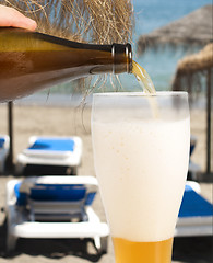 Image showing Beer and beach background