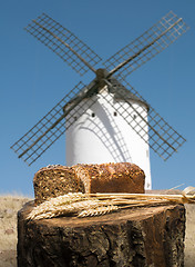 Image showing Different breads and windmill in the background