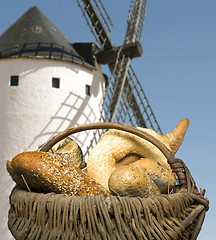 Image showing Different breads and windmill in the background