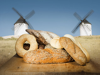 Image showing Different breads and windmill in the background