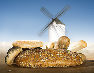 Image showing Different breads and windmill in the background