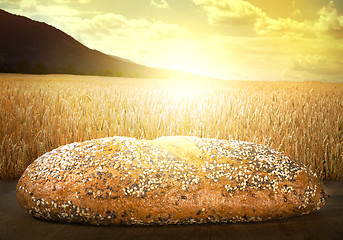 Image showing Bread and wheat cereal crops at sunset