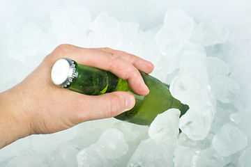 Image showing Bottle of beer and ice cubes