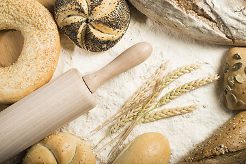 Image showing Breads. Pile of flour, rolling pin and wheat