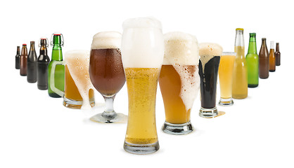 Image showing Mug filled with beer and bottles