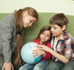 Image showing Kids looking at globe