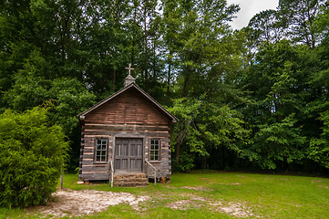 Image showing old wood log cabin church in forest