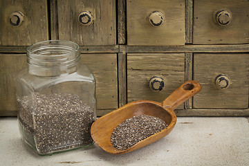 Image showing jar and scoop of chia seeds