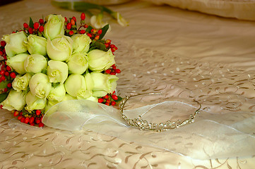 Image showing Bouquet of flowers on bed