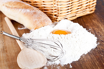 Image showing bread, flour, eggs and kitchen utensil 