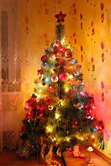 Image showing harmonous and dressed up New Year's fur-tree