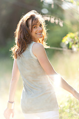 Image showing attractive smiling adult woman outside in summer