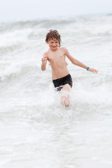 Image showing young little boy in water summer holiday fun sea 