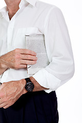 Image showing attractive adult businessman reading newspaper isolated