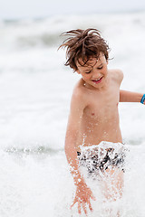 Image showing young little boy in water summer holiday fun sea 