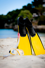 Image showing yellow fins and snorkelling mask on beach in summer