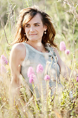 Image showing adult brunette woman smiling in summertime outdoor