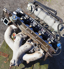 Image showing Disassembled the engine of an old car