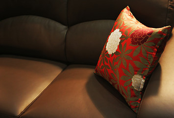 Image showing Pillow on a leather sofa