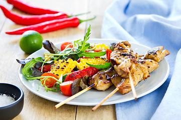 Image showing Grilled chicken skewer with salad