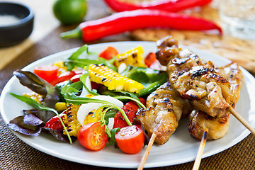 Image showing Grilled chicken skewer with salad