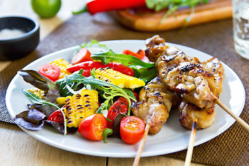 Image showing Grilled chicken skewer with salad