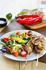 Image showing Grilled chicken skewer with salad