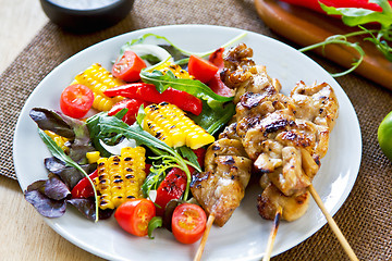 Image showing Grilled chicken skewer with salad