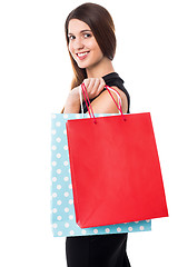 Image showing Shopping woman carrying bags