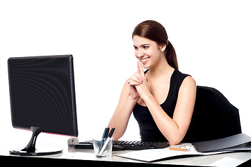 Image showing Smiling corporate lady in her office