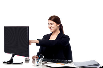 Image showing Female staff pointing at monitor screen