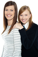 Image showing Daughter resting hands on mothers shoulders