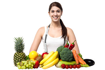 Image showing Beautiful young woman with fruits