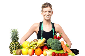 Image showing Slim fit girl with fresh fruits and vegetables