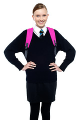 Image showing Smiling schoolgirl posing with confidence