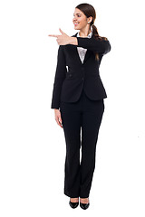 Image showing Corporate lady pointing at something